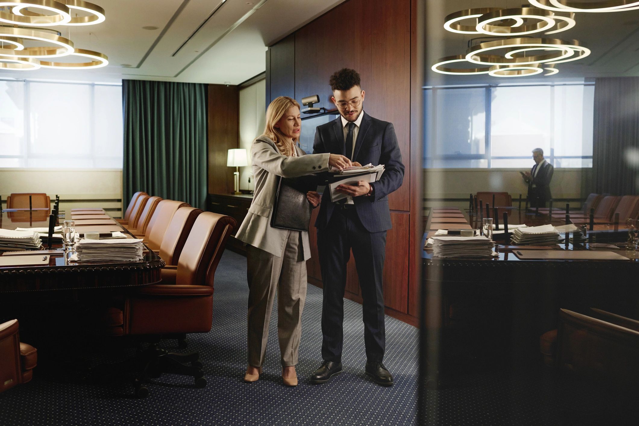 Attorneys reviewing case documents in a professional conference room