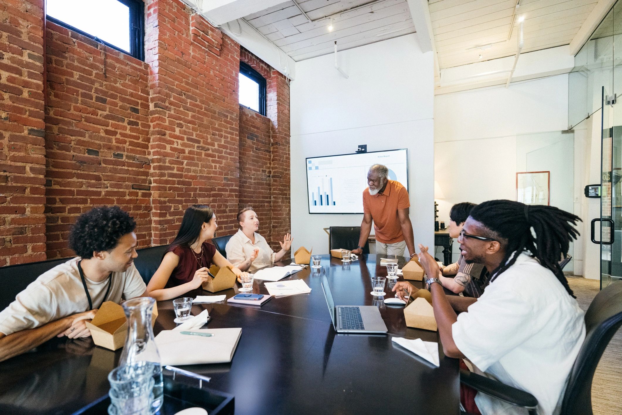 Law firm team meeting together in a conference room